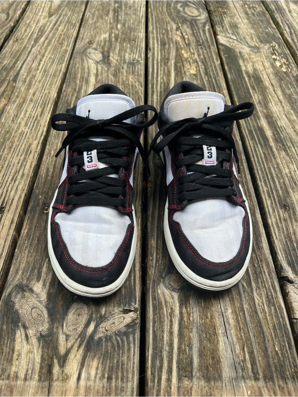 Air Jordan Low Top Sneakers in Black & White with Red Stitching
